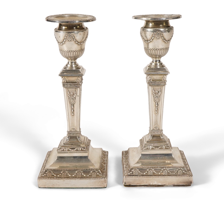 A pair of Victorian silver candlesticks, with fixed sconces, by Henry Wilkinson & Co